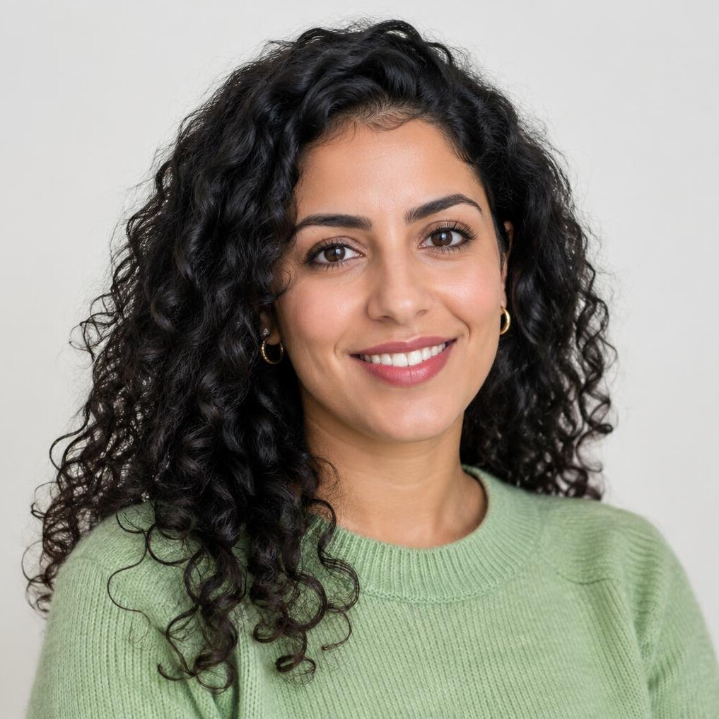 Portrait of a smiling young woman with curly hair